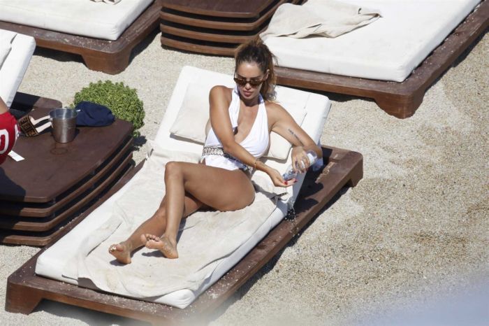 Nabilla Benattia Relaxing In A White Swimsuit At A Pool
